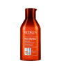 Redken Frizz Dismiss Shampoo bottle for anti-frizz and humidity control, suitable for all hair types and textures.
