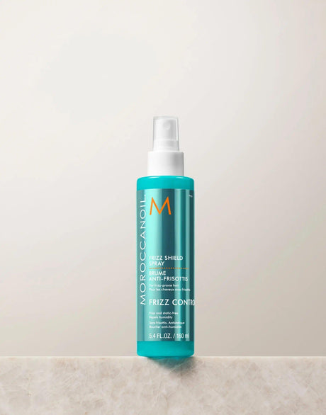 Frizz Shield Spray bottle for frizz protection and lasting shine, enriched with argan oil