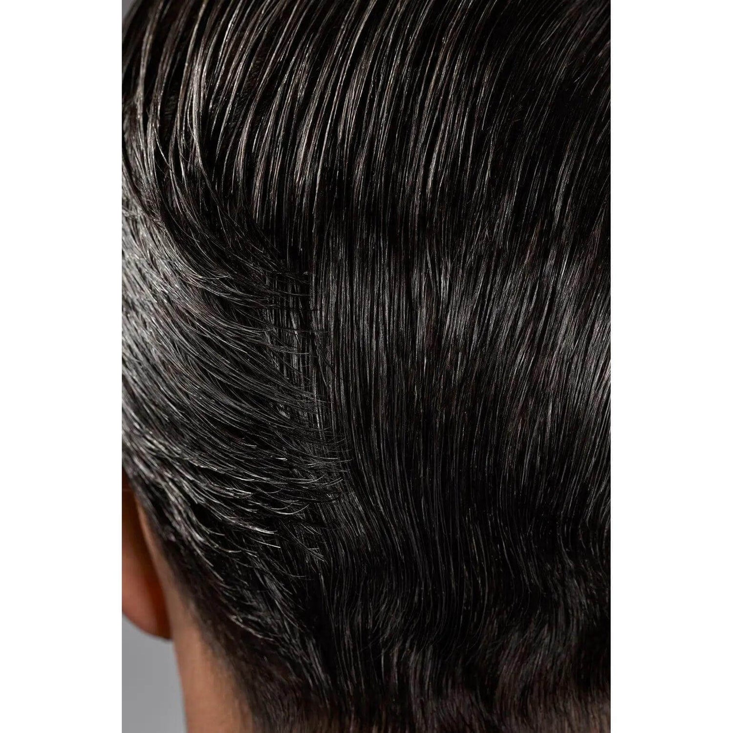 Close-up of hair styled with Gel Serum, showcasing glossy shine and flexible hold without stiffness, enhancing hair hydration.