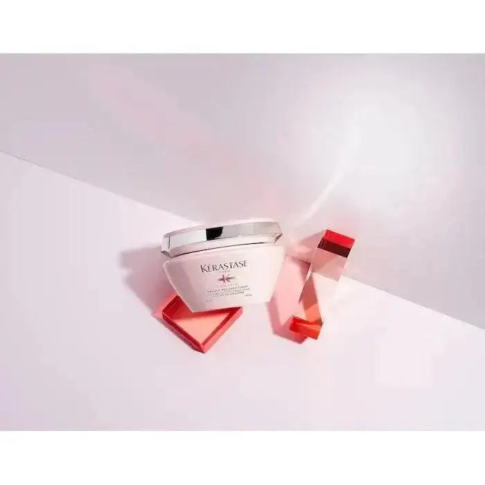 Kérastase Masque Reconstituant for damaged hair restoration and strengthening with red translucent accents.