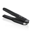 Black Ghd cordless hair straightener, portable design with ceramic heaters and dual-zone technology for styling on the go.