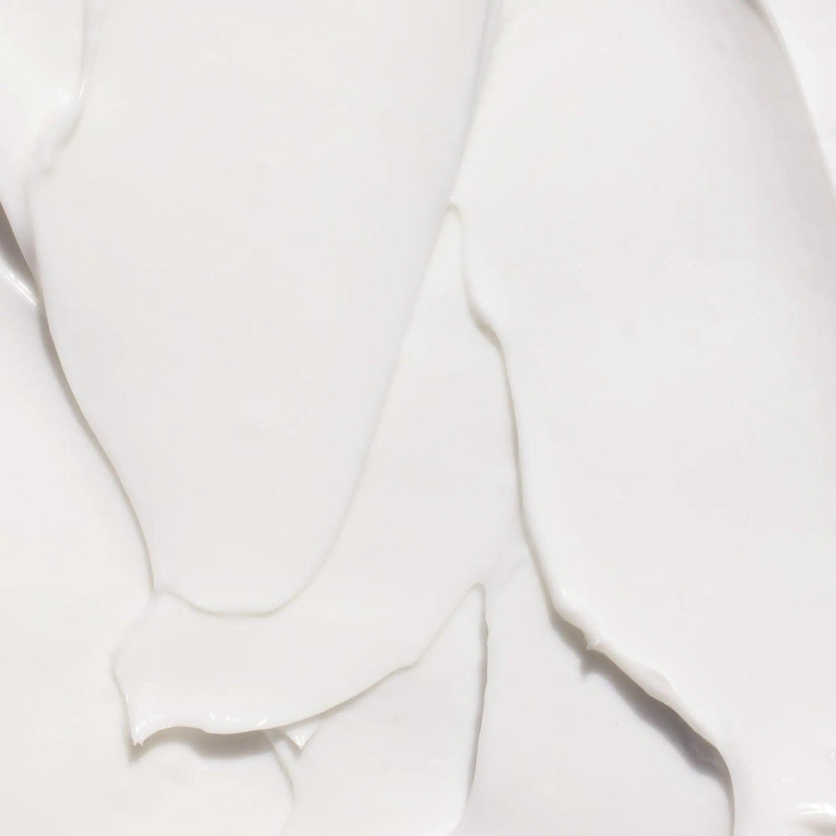Close-up texture of Gilded Woods Body Lotion with Shea Butter, Aloe Vera, Vitamin E, and Omega Fatty Acids.