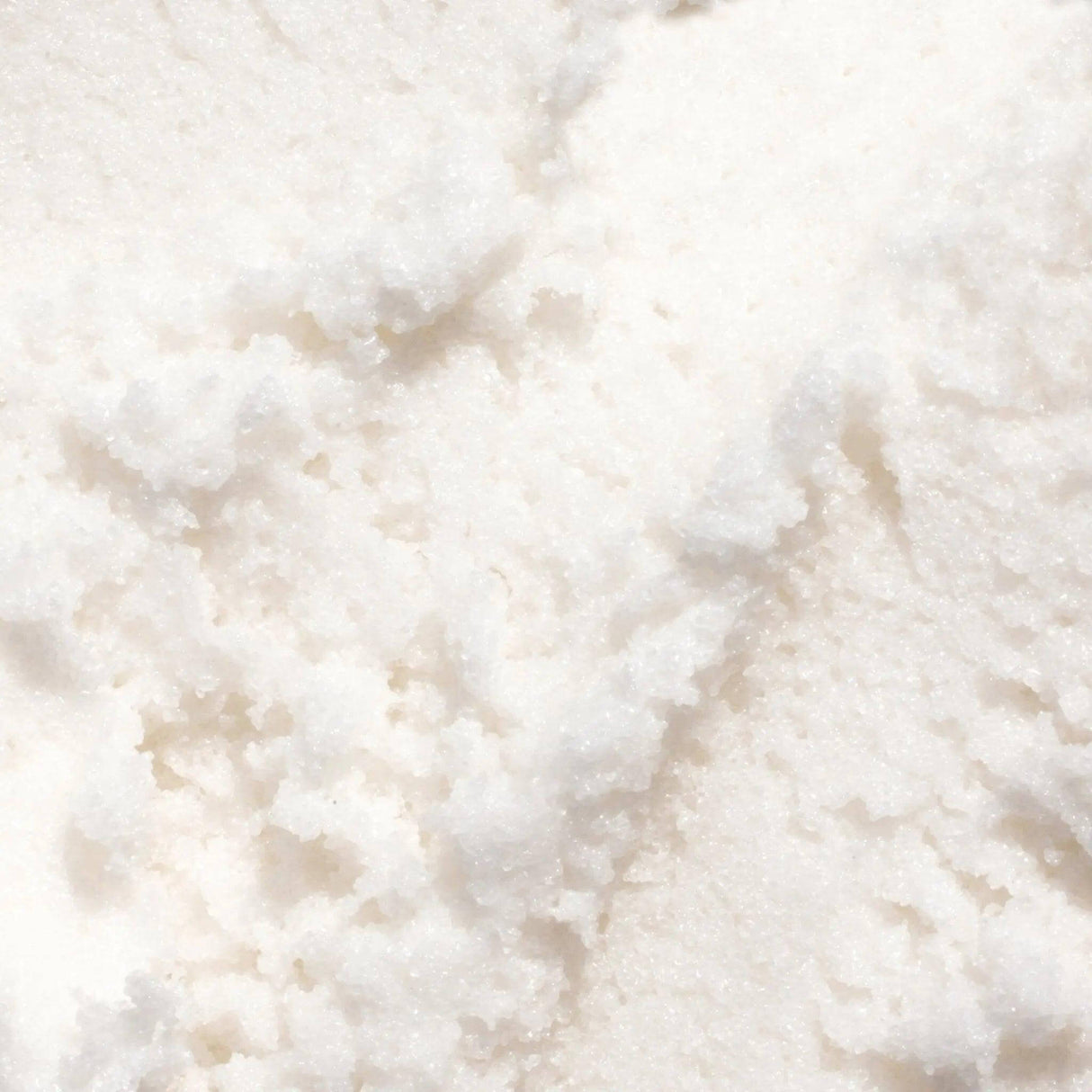Close-up of Gilded Woods Body Scrub texture showcasing its rich, exfoliating formula with pure cane sugar and coconut oil.