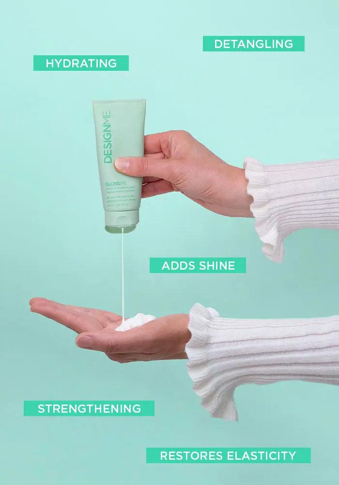 Hand holding Design.Me hair product tube with hydrating, adds shine, strengthening, detangling, and elasticity benefits.