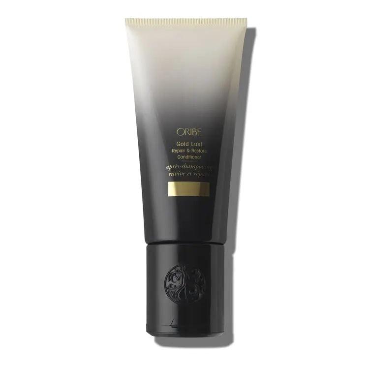 Oribe Gold Lust Repair & Restore Conditioner tube with black and gold packaging.
