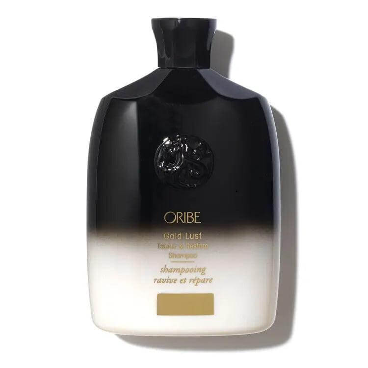 Oribe Gold Lust Repair & Restore Shampoo bottle, nourishing daily hair care for shiny and healthy hair, 8.5 fl oz.