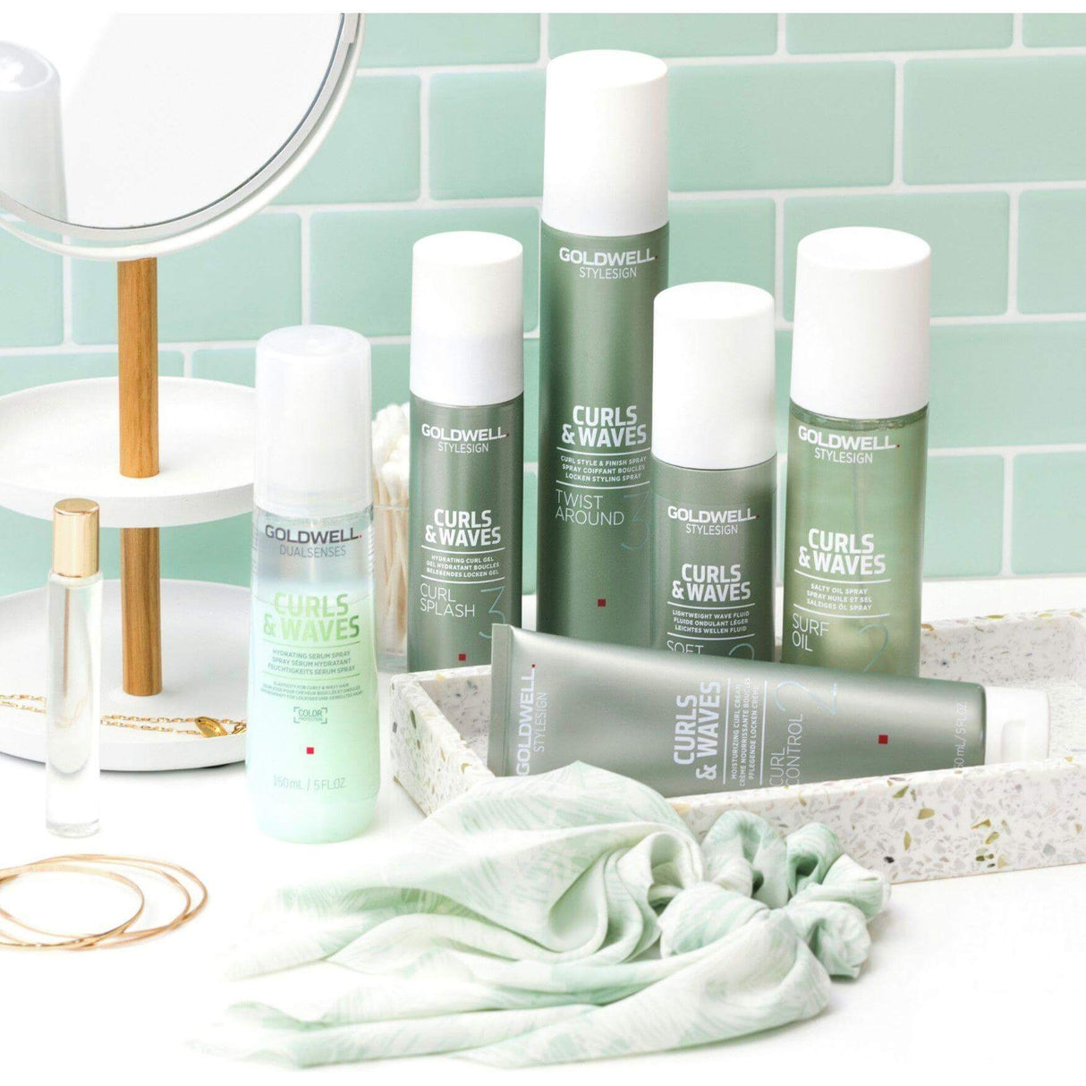 Goldwell Dualsenses Curls & Waves hair care products displayed on a bathroom counter, ideal for curly and wavy hair treatment.