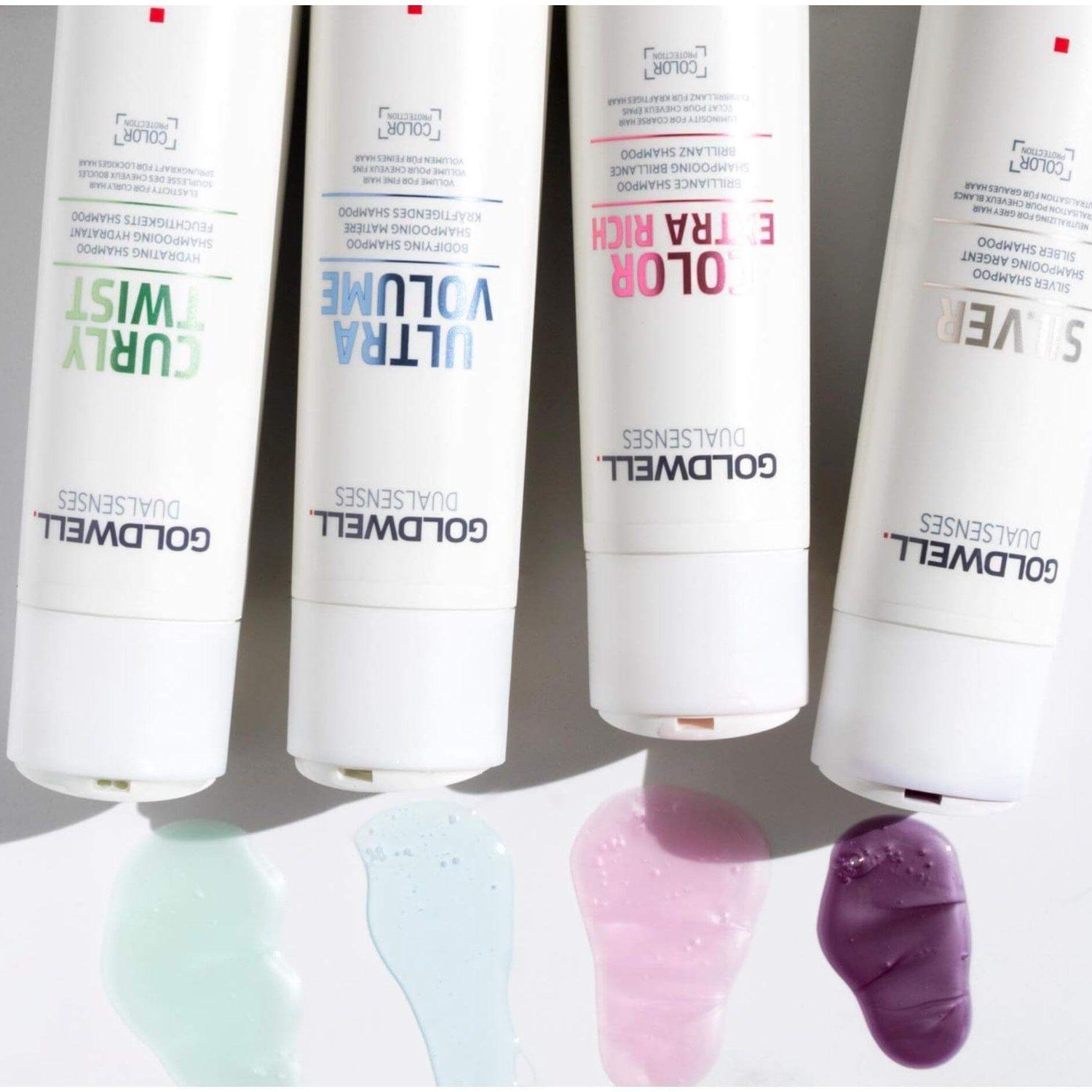 Goldwell Dualsenses shampoo range, including Curly Twist, Ultra Volume, Color Extra Rich, and Silver, with samples on white background.