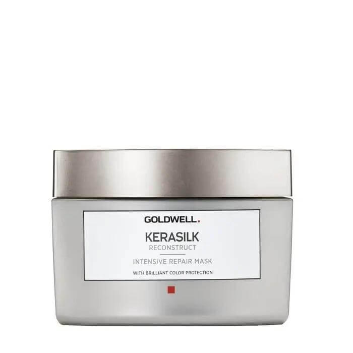 Goldwell Kerasilk Reconstruct Intensive Repair Mask for dry, damaged hair in a silver jar, providing hydration and protection.