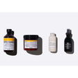 Davines Heatless Natural Waves Set with Nourishing Shampoo, Vegetarian Mask, Curl Cream, and All in One Milk, four hair care products.