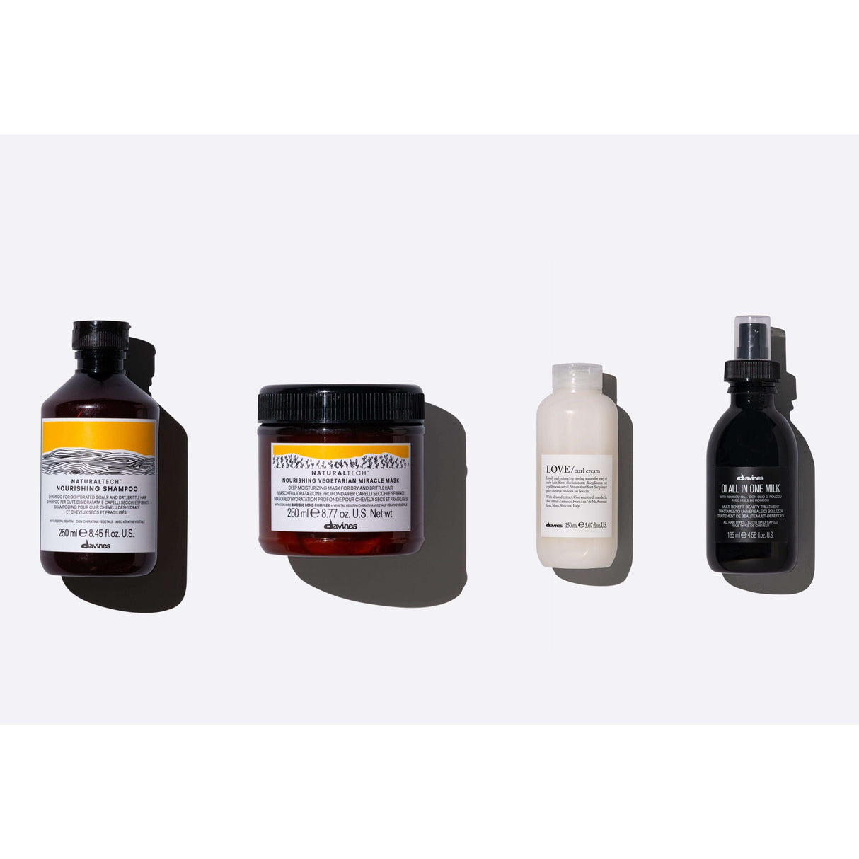 Davines Heatless Natural Waves Set with Nourishing Shampoo, Vegetarian Mask, Curl Cream, and All in One Milk, four hair care products.