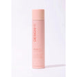Hold.Me Three-Way Hairspray bottle offering light, medium, and high hold levels in a sleek design.