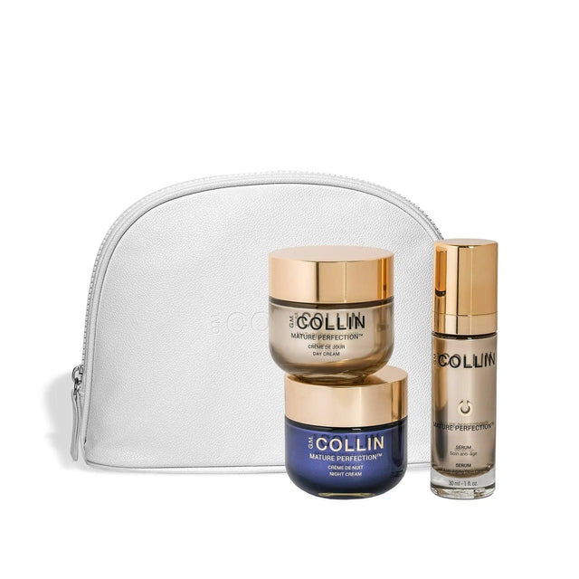 Holiday Perfection gift set with Mature Perfection Serum, Day Cream, Night Cream, and vegan leather white pouch for mature skin care.