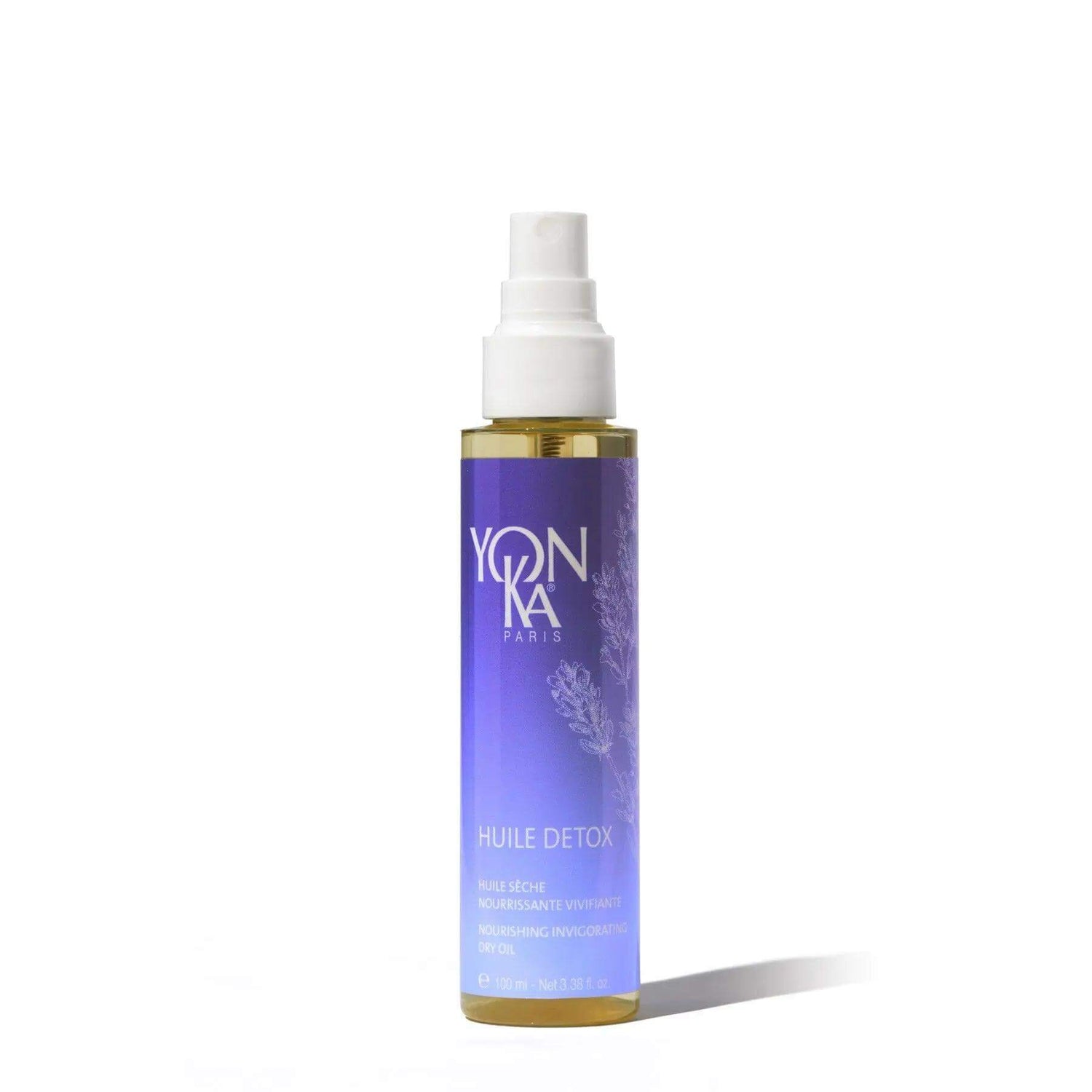 Bottle of Yonka Huile Detox facial oil for radiant and clear complexion, suitable for all skin types, with botanical oils.