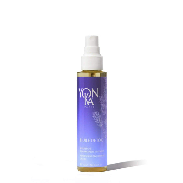 Bottle of Yonka Huile Detox facial oil for radiant and clear complexion, suitable for all skin types, with botanical oils.