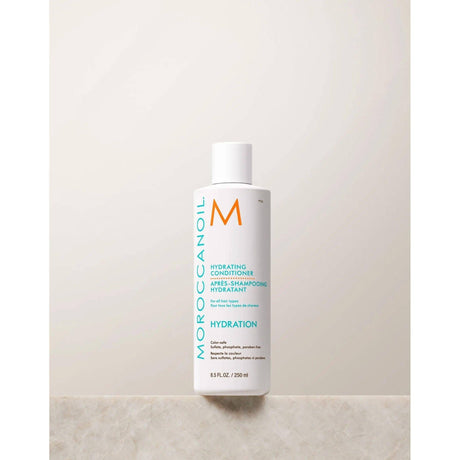 Moroccanoil Hydrating Conditioner bottle, enriched with argan oil and vitamins, designed to moisturize and detangle dry hair.
