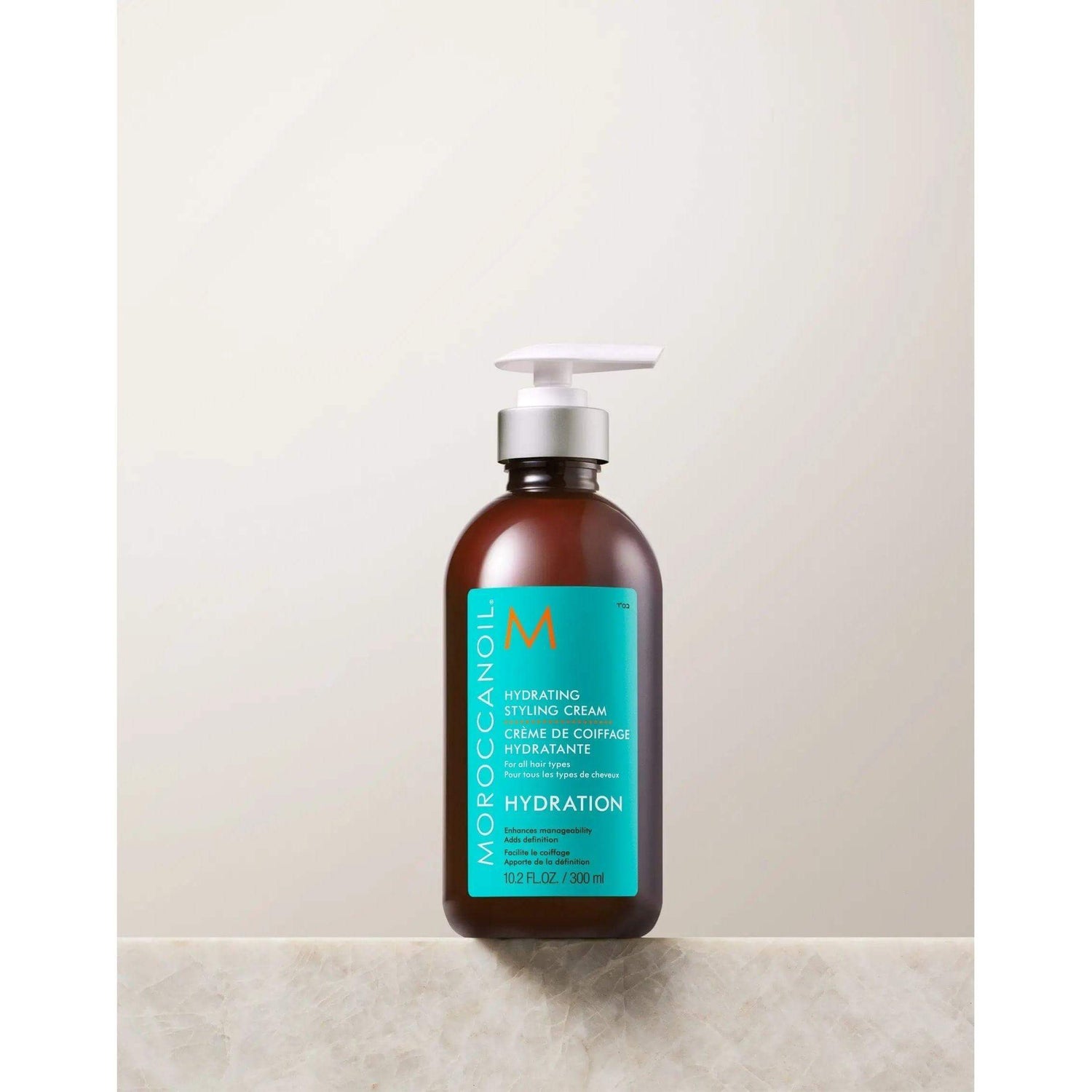 Moroccanoil Hydrating Styling Cream bottle for moisturizing, frizz control, and soft styling with argan oil and gentle hold.