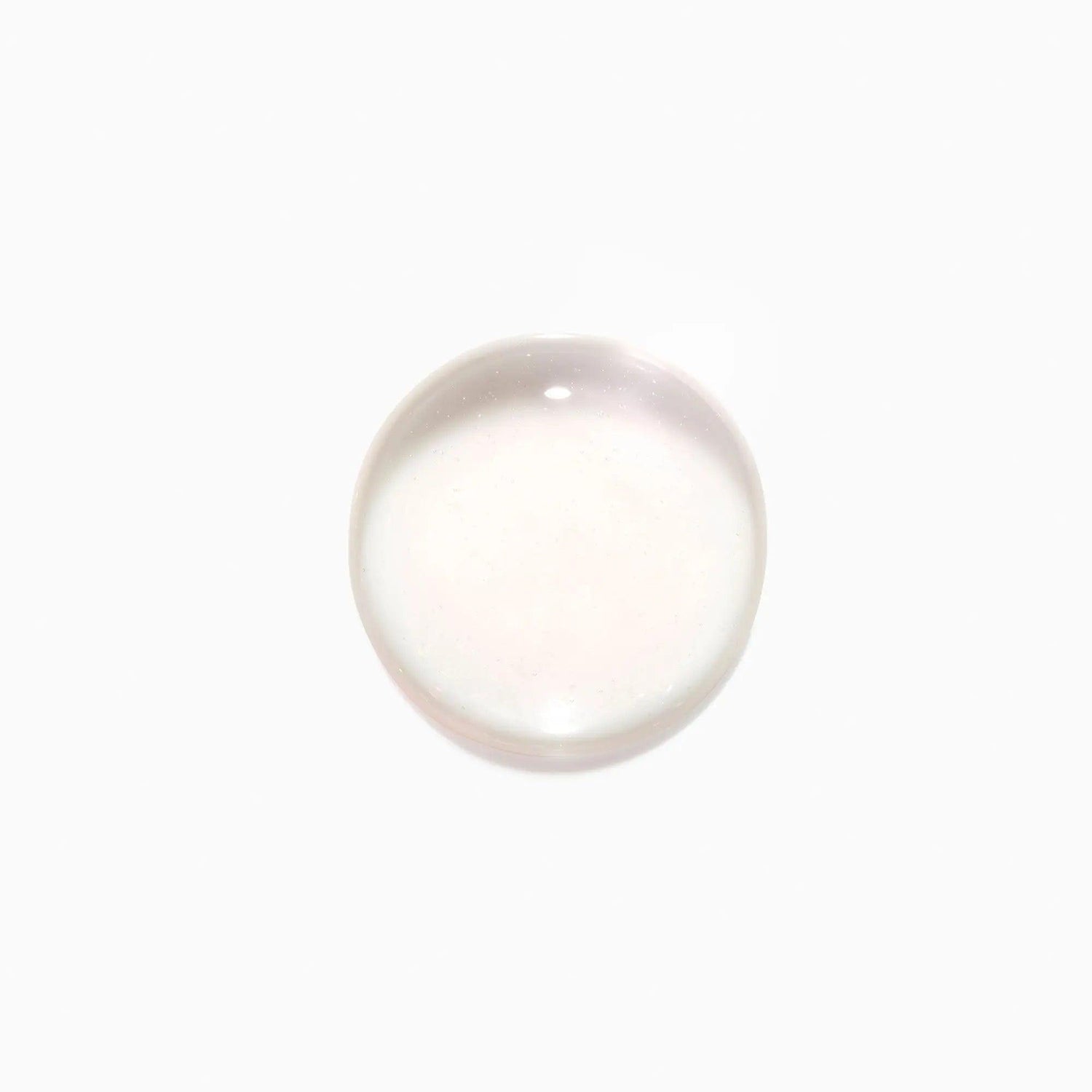 Clear drop of Initialiste serum for scalp health and hair growth