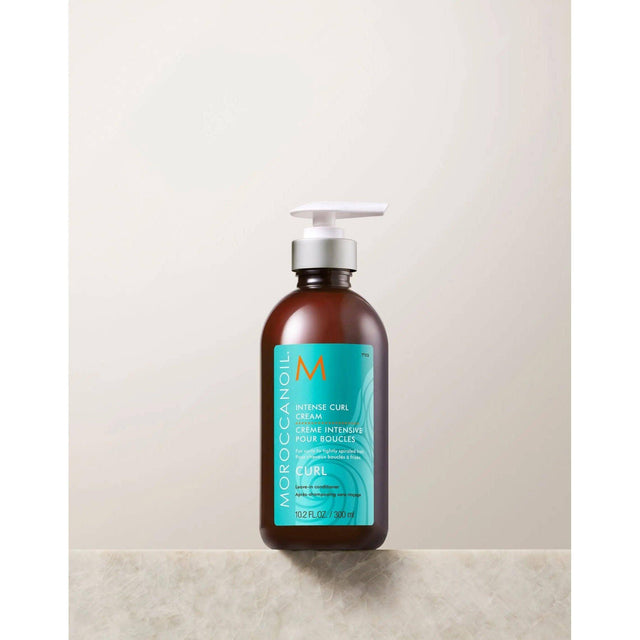 Moroccanoil Intense Curl Cream bottle for shiny, shapely curls and frizz control with nourishing argan oil. 10.2 fl oz size.