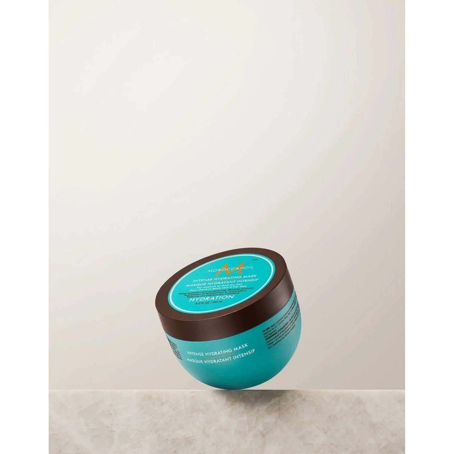 Moroccanoil Intense Hydrating Mask jar for dry, medium to thick hair on a neutral background.