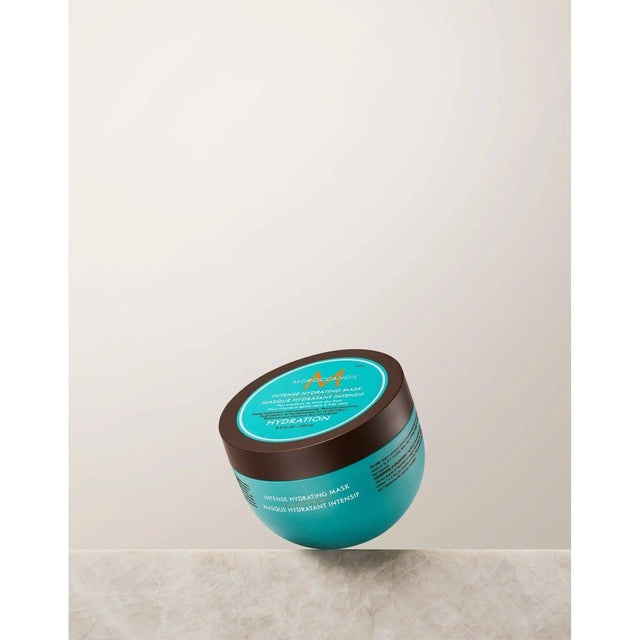 Moroccanoil Intense Hydrating Mask jar for dry, medium to thick hair on a neutral background.