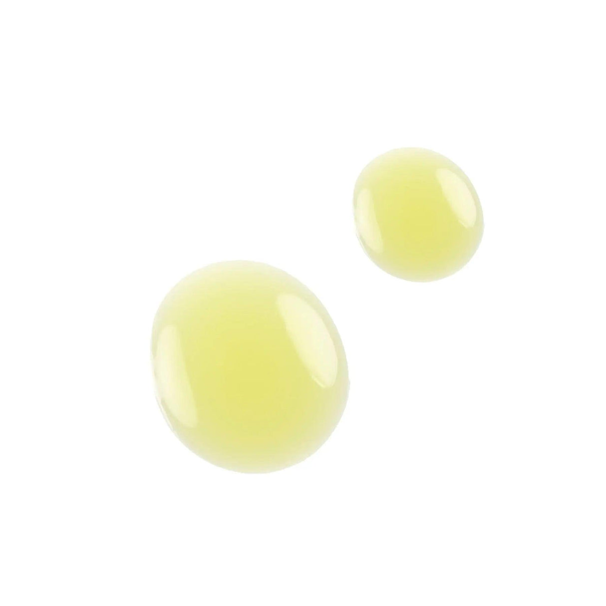 Close-up of thick yellow gel drops, illustrating the texture of the Intensive Exfoliating Gel for deep cleansing and skin revitalization.