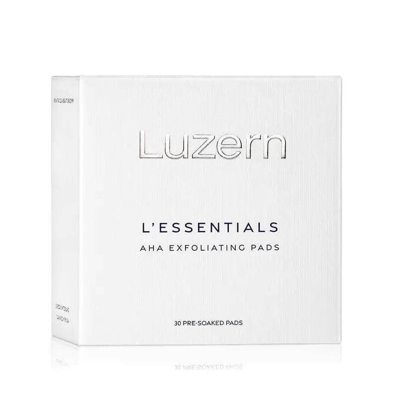 Luzern L'Essentials AHA Exfoliating Pads packaging, pre-soaked with Alpha Hydroxy Acids for enhanced skin smoothness and radiance.