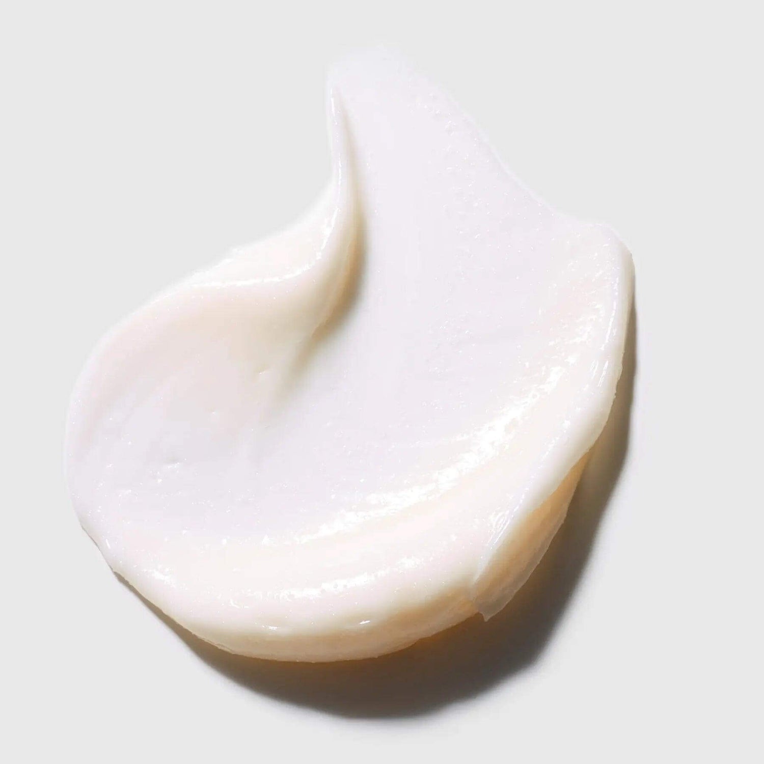 Creamy texture of L'Essentials Micro-Exfoliant with natural jojoba beads for gentle skin exfoliation and impurity removal.