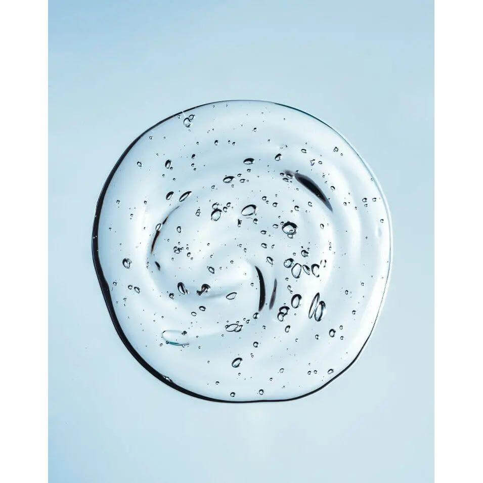Close-up of clear lemon scent sanitizer gel with bubbles, ideal for fighting germs and bacteria. Smooth, non-greasy texture.