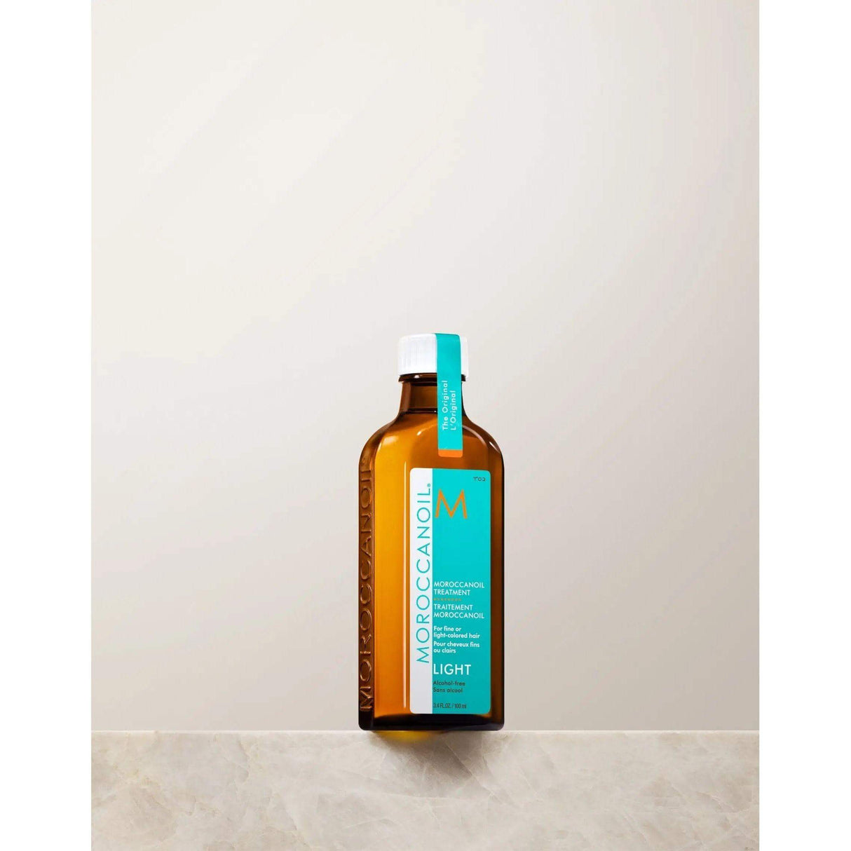 Moroccanoil Light Treatment bottle with argan oil for fine hair, controls frizz, enhances shine, softness, and strength.