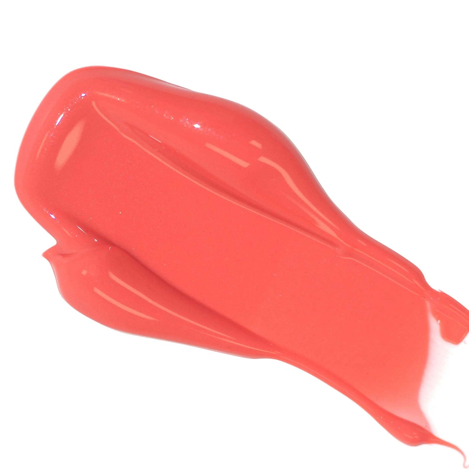 Smooth swatch of coral Lip Colour Serum showing vibrant, nourishing, all-natural color and hydrating gloss.