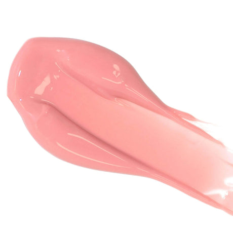 Close-up of pink lip color serum swatch with a glossy finish, highlighting its nourishing, natural ingredients and hydrating properties.