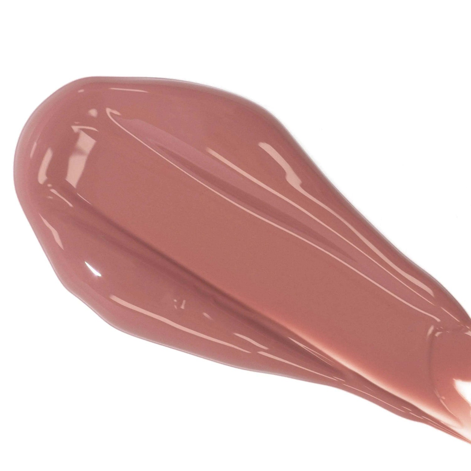 Close-up of Lip Colour Serum with nourishing ingredients and a glossy finish for natural plumping and hydration in a soft pink tone.