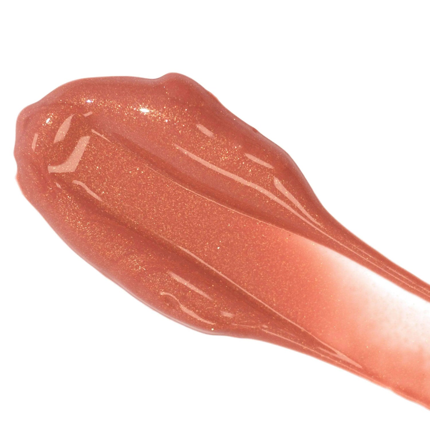 Swatch of all-natural lip colour serum in shimmery peach shade, highlighting glossy, nourishing texture.