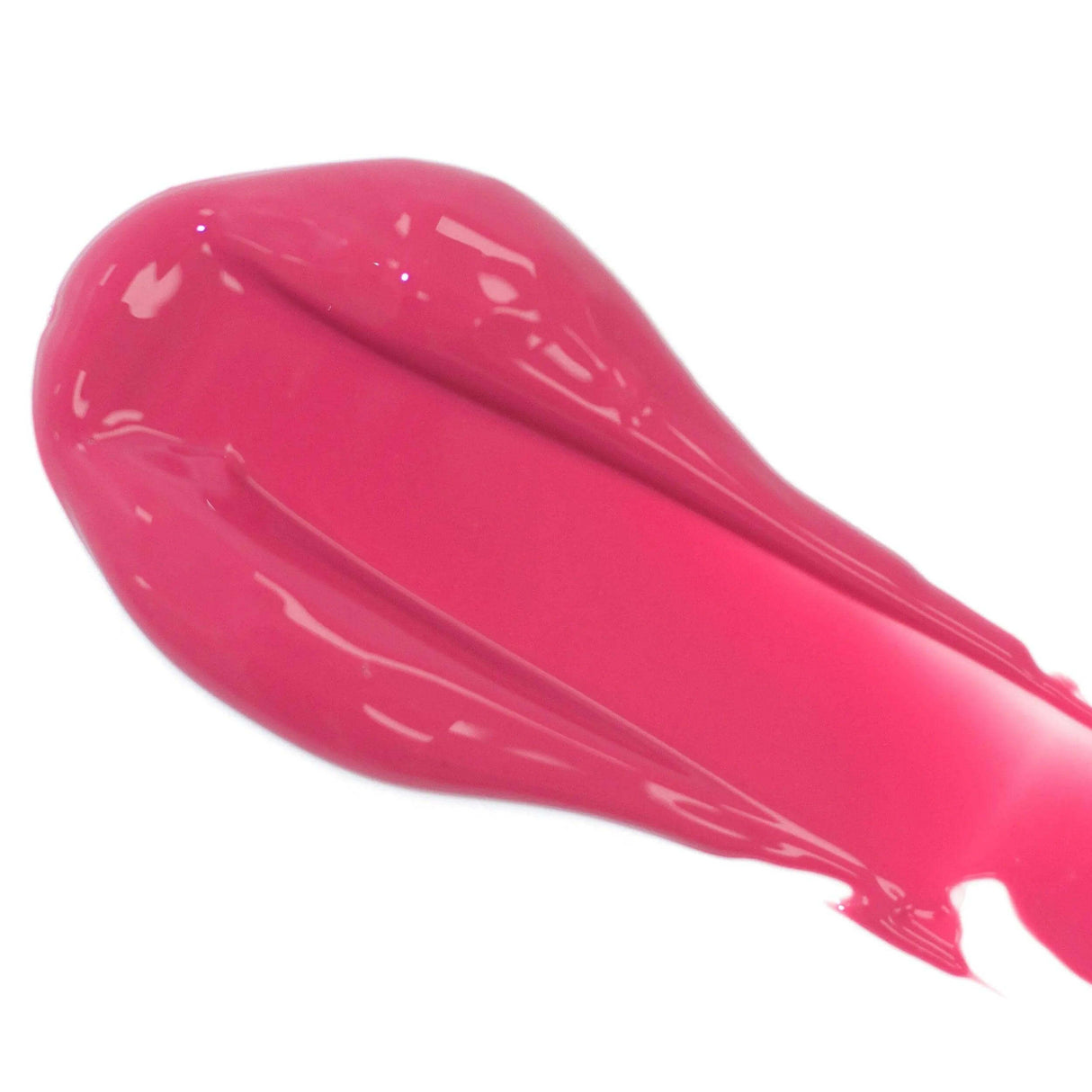 Close-up image of vibrant pink lip serum smear, showcasing its glossy texture and nourishing ingredients.