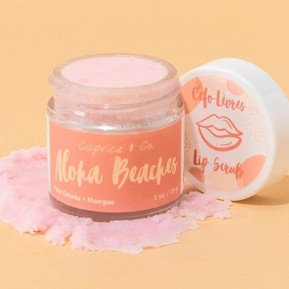 Lip Scrub Aloha Beaches jar with Pina Colada and Mango flavor showcasing pink exfoliating sugar texture, 1oz-28g, by Caprice & Co.