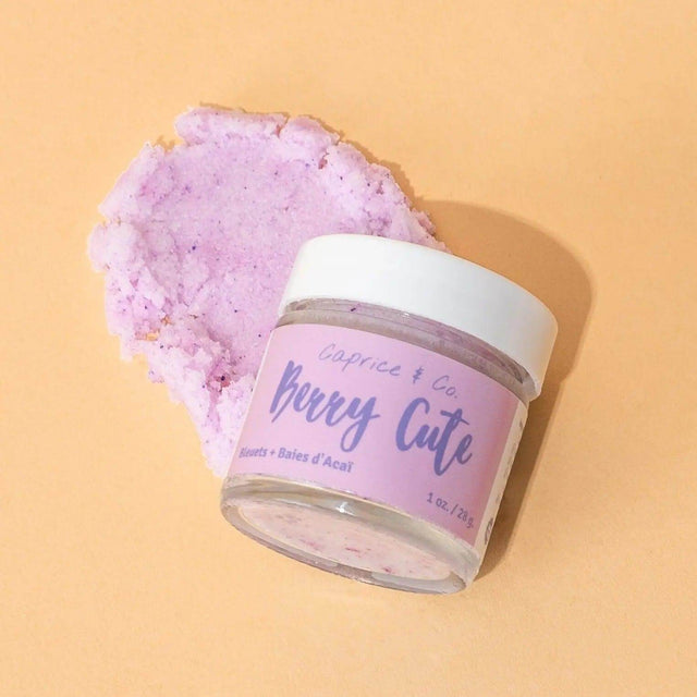 Berry Cute Lip Scrub with acai and blueberry flavors for soft, smooth lips, featuring hydrating jojoba oil and shea butter, 1 oz jar.