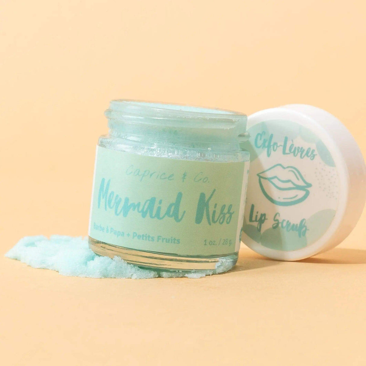 Mermaid Kiss Lip Scrub in jar with lid, cotton candy and berry flavor for smooth lips, 1oz-28g, featuring exfoliating sugar and shea butter.