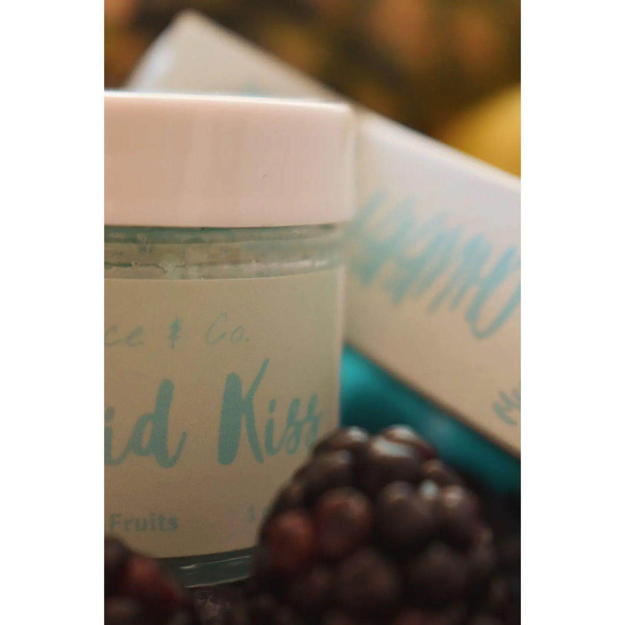 Mermaid Kiss lip scrub jar with berries, fine sugar, and organic oils for soft lips. Edible cotton candy flavor, 1oz jar.