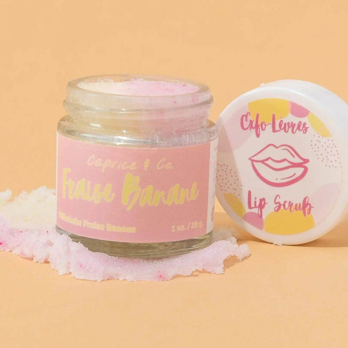 Strawberry Banana Lip Scrub jar with exfoliating sugar and nourishing oils, 1 oz. Organic Jojoba and Shea butter for smooth lips.