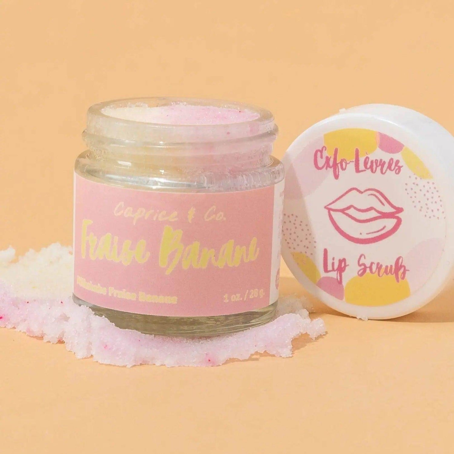 Strawberry Banana Lip Scrub jar with exfoliating sugar and nourishing oils, 1 oz. Organic Jojoba and Shea butter for smooth lips.
