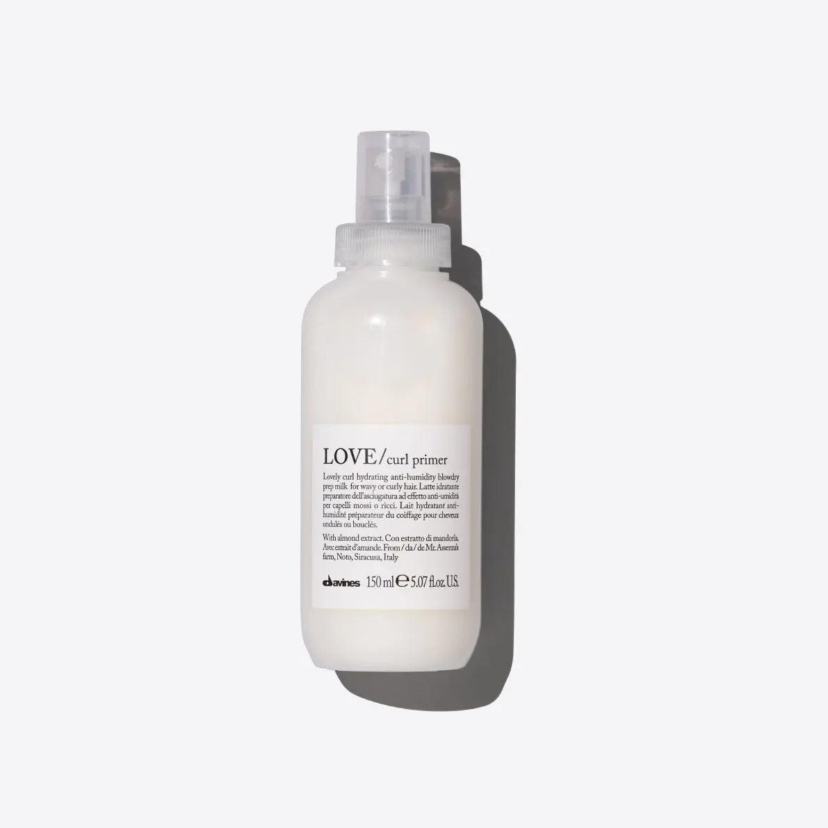 Davines Love Curl Primer product bottle for enhancing curly hair, reducing frizz, and boosting shine with nourishing ingredients.