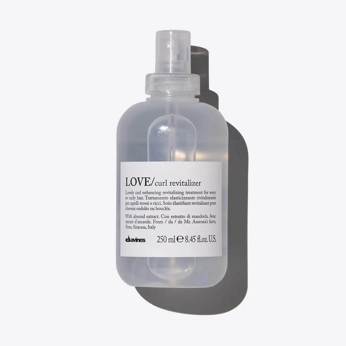 Davines Love Curl Revitalizer bottle for curly hair care, 250 ml, enhances curls, reduces frizz, and promotes softness and hydration.
