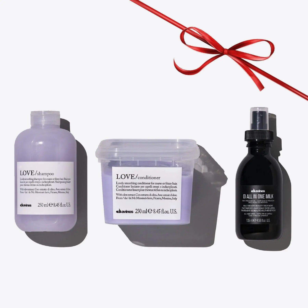 Davines Love Smoothing + Oi Set including Love Shampoo, Love Conditioner, and Oi All In One Milk for smooth and nourished hair.