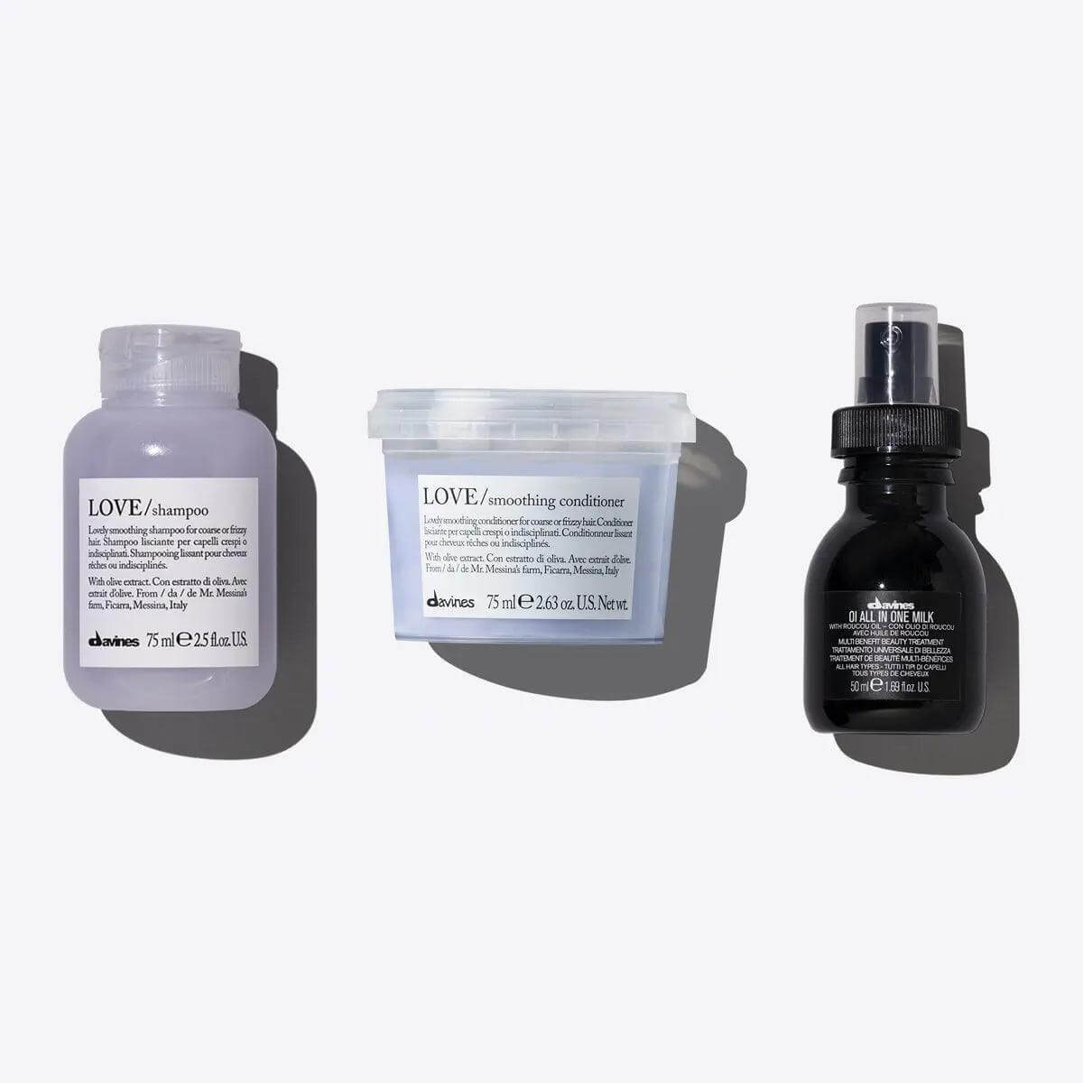 Davines Love Smoothing + Oi Signature Travel Set with shampoo, conditioner, and All In One Milk for smooth, nourished hair.