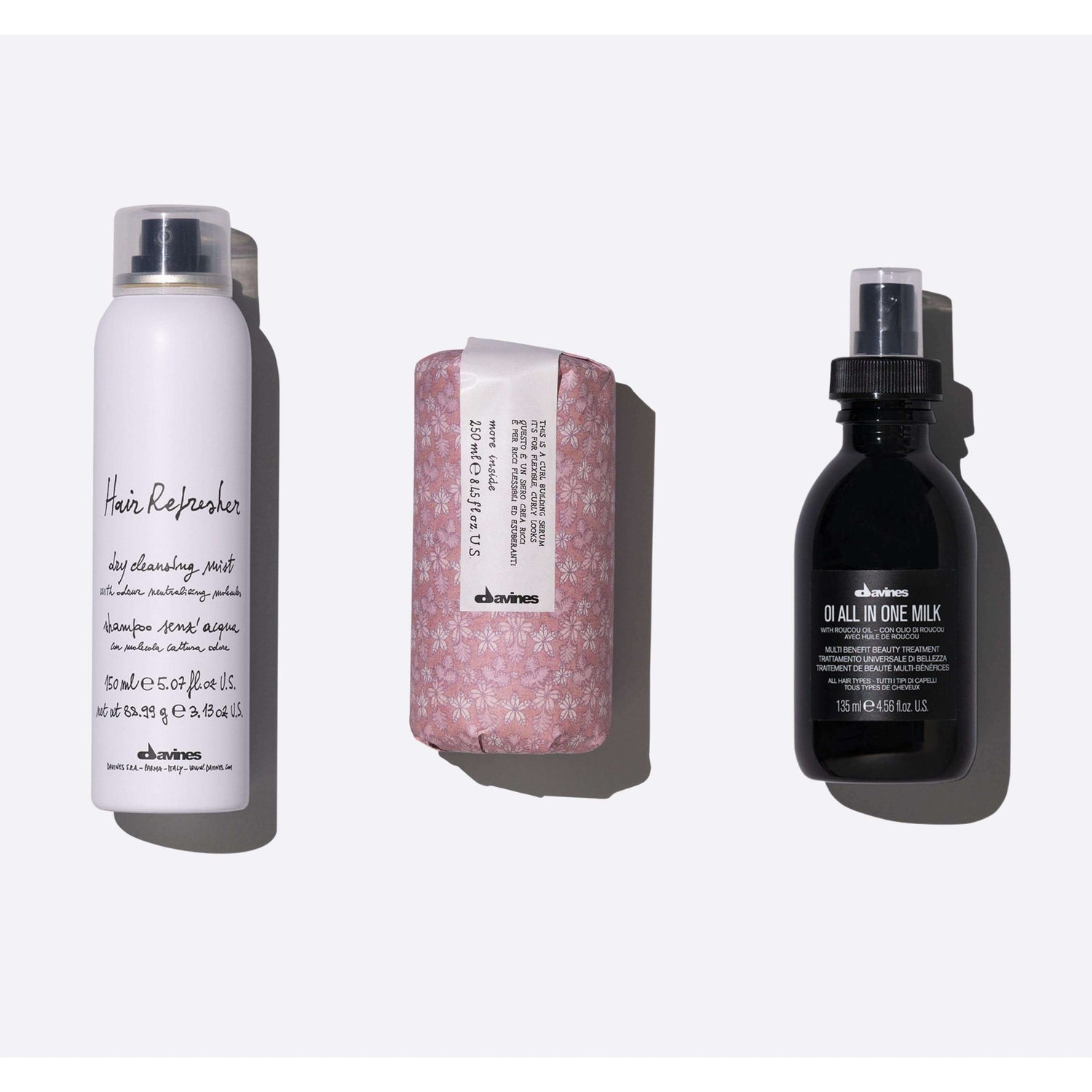 Low-Maintenance Textured Hair Set with Hair Refresher, OI All In One Milk, and Curl Building Serum for quick styling.