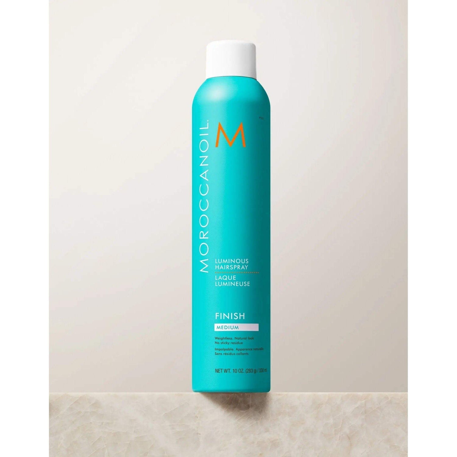 Moroccanoil Luminous Hairspray Medium bottle for soft, natural styles with long-lasting hold and reflective shine.