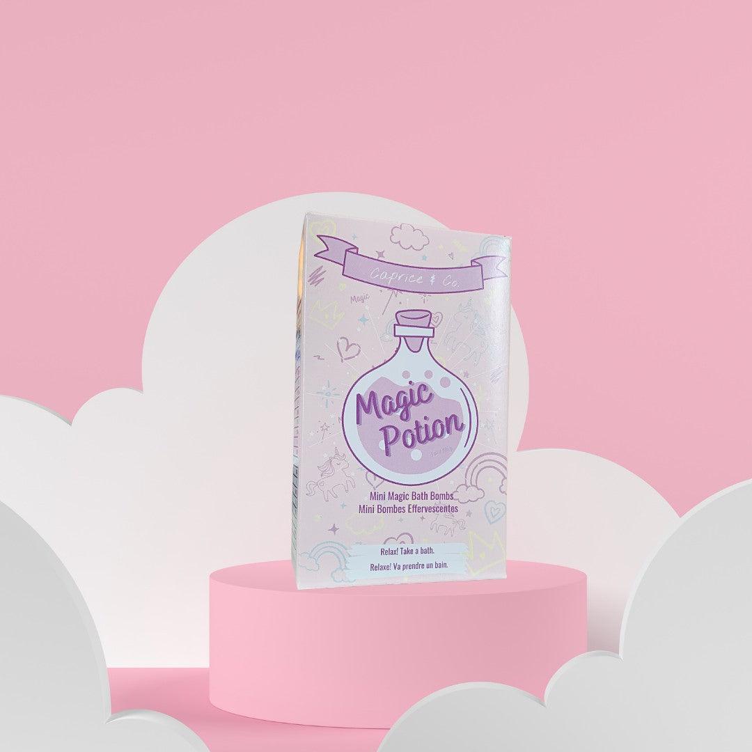 Magic Potion Mini Bath Bombs packaging on a pink and white cloud background.