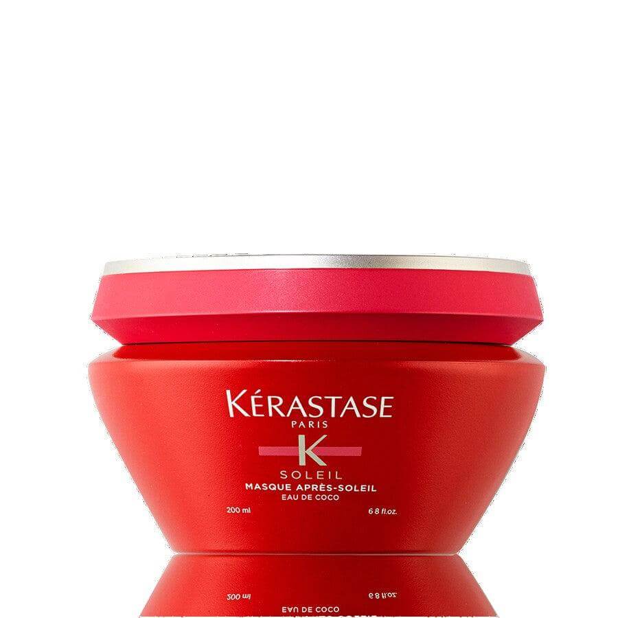 Kérastase Masque Après Soleil Hair Mask in red jar, infused with coconut water for hydration and sun protection.