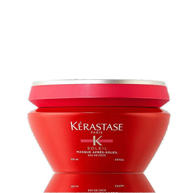 Kérastase Masque Après Soleil Hair Mask in red jar, infused with coconut water for hydration and sun protection.